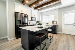 Designer kitchen in the Palisade showhome by Bedrock Homes in the Hills at Charlesworth.