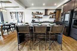 Upgraded kitchen in the Callie showhome by Bedrock Homes in Robinson, Leduc.